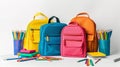 school backpacks and school supplies on a white background Royalty Free Stock Photo