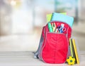 School bag on table indoors background. School supplies. Royalty Free Stock Photo