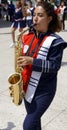 School band march girl playing saxophone