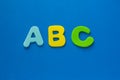 School begginnings. ABC colored letters on blue background, copy space Royalty Free Stock Photo