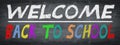 SCHOOL BEGINNING Background banner panorama - Old rustic school blackboard, chalkboard with colorful handlettering: WELCOME BACK