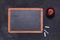 School blackboard with chalks and red apple Royalty Free Stock Photo