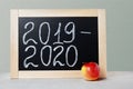 School board with text academic year 2019 2020. Background School blackboard and apple