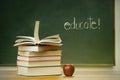 School books and apple on desk Royalty Free Stock Photo