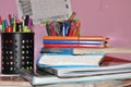 School books on desk, Back to school supplies. Books and blackboard on wooden background, education concept Royalty Free Stock Photo