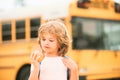 School boy on school bus. School Child Pupil with apple.