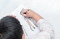 School boy drawing picture with color pencil, Royalty Free Stock Photo