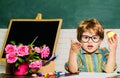 School boy having lunch with apple. Healthy food for children. Little pupil during lunch break in classroom. Royalty Free Stock Photo