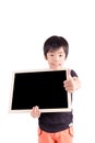 school boy holding a blank black board, isolated on white background Royalty Free Stock Photo