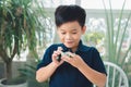 School boy playing with toy car on a table at home Royalty Free Stock Photo