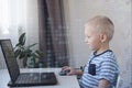 Young programmer writing code on a computer at home. Programming lessons for kids. Royalty Free Stock Photo