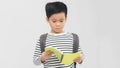 School boy reading a book - isolated over a white background Royalty Free Stock Photo