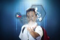 School boy showing facts about the Philippines through virtual screen hologram technology. Royalty Free Stock Photo