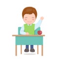 School boy sitting at desk isolated