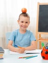 School boy sitting at home classroom lying desk filled with books training material schoolchild sleeping lazy bored Royalty Free Stock Photo