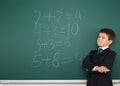 School boy solve math on school board Royalty Free Stock Photo