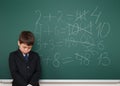 School boy solve math on school board Royalty Free Stock Photo