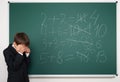 School boy solve math on school board Royalty Free Stock Photo