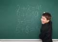 School boy solve math on school board Royalty Free Stock Photo