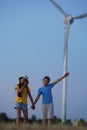 School boy stand on the wind farm. Wind turbines alternative electricity sources. Future of kid and sustainable Royalty Free Stock Photo