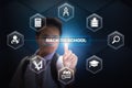 School boy touching Back to school button using Virtual Screen Hologram Royalty Free Stock Photo