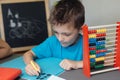 School boy working on math homework Royalty Free Stock Photo