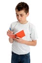 School boy writing in book Royalty Free Stock Photo