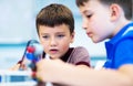 School Boys playing with construction set. Royalty Free Stock Photo