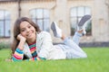 School break for rest. Adorable pupil. Girl kid laying lawn. Girl school uniform enjoy relax. Importance of relaxation