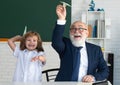 School break with teacher. Pupil with airplanes. Education, teachering, learning. Schoolboy in classroom. Royalty Free Stock Photo