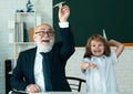 School break with teacher. Pupil with airplanes. Education, teachering, learning. Schoolboy in classroom. Royalty Free Stock Photo