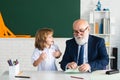 School break with teacher. Schoolboy with airplanes. Education, teachering, learning. Pupil in classroom.