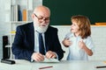 School break with teacher. Schoolboy with airplanes. Education, teachering, learning. Pupil in classroom. Royalty Free Stock Photo