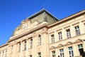 School building with clocks and flags Royalty Free Stock Photo