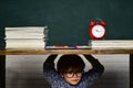 School bullying. Hard exam. Boy pupil getting bullied in school. Royalty Free Stock Photo