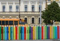 School bus, colorful pencils fence, Victorian building. Royalty Free Stock Photo