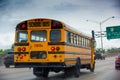 School bus on the highway in Miami on a cloudy day