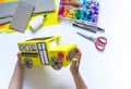 School bus made of cardboard. DIY children`s pencil case for stationery paper craft