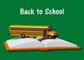 School bus over book isolated on green background. Back to school concept Royalty Free Stock Photo