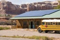 School Bus Parked At Laundry Shop by Rocky Mountains Royalty Free Stock Photo