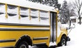 School bus parked in a residential neighborhood during a snow da