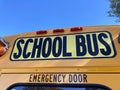 School bus sign above rear emergency exit door. Close up