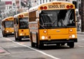 School buses driving Royalty Free Stock Photo