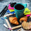 School business stationery croissants mug of coffee on grunge chalkboard Royalty Free Stock Photo