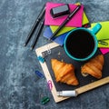 School business stationery croissants mug of coffee on grunge chalkboard Royalty Free Stock Photo