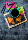 School business stationery croissants mug of coffee on grunge chalkboard Royalty Free Stock Photo