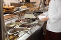 School canteen worker at serving line