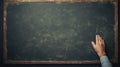 School chalkboard. Hand holding the board Royalty Free Stock Photo