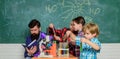 School chemistry lab concept. Experimenting together. Supportive environment explore STEM. Practical knowledge. Child Royalty Free Stock Photo