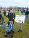 school child at anti climate change protest in The Hague with banners walking through the city
